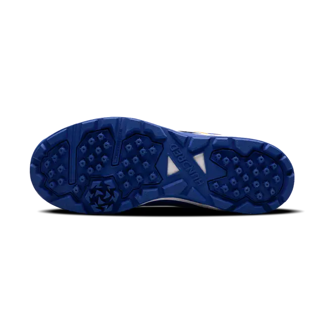 Close-up of Hundred Hyperturf cricket shoes featuring durable sole grip and sleek athletic design.
