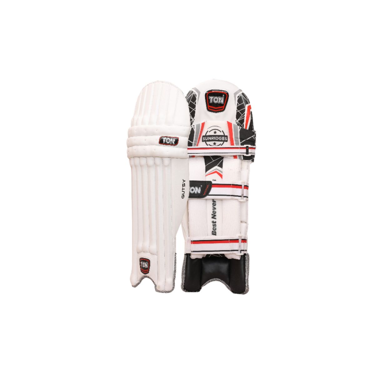 Lightweight Ton Gutsy cricket batting pads placed on a cricket field, showcasing their ergonomic design and durable build.