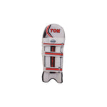Ton Supreme cricket leg guards featuring premium padding and reinforced knee protection, displayed on a grassy cricket pitch.