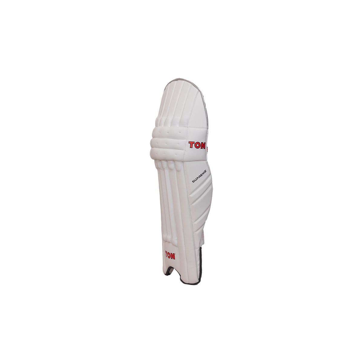 Ton Supreme cricket leg guards featuring premium padding and reinforced knee protection, displayed on a grassy cricket pitch.