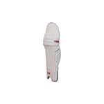 Ton Supreme cricket leg guards featuring premium padding and reinforced knee protection, displayed on a grassy cricket pitch.