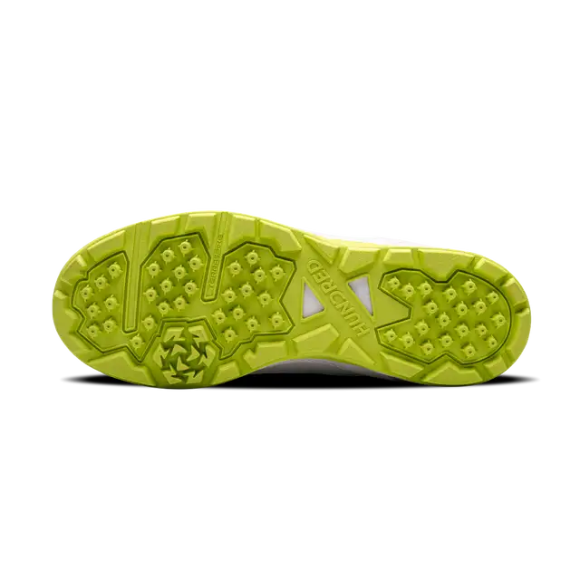Close-up of Hundred Hyperturf cricket shoes featuring durable sole grip and sleek athletic design.
