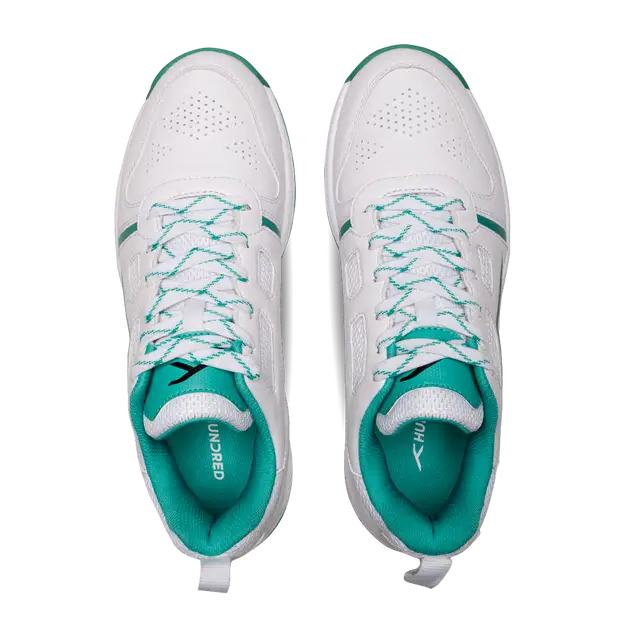 Close-up of Hundred Hyperturf cricket shoes featuring durable sole grip and sleek athletic design.