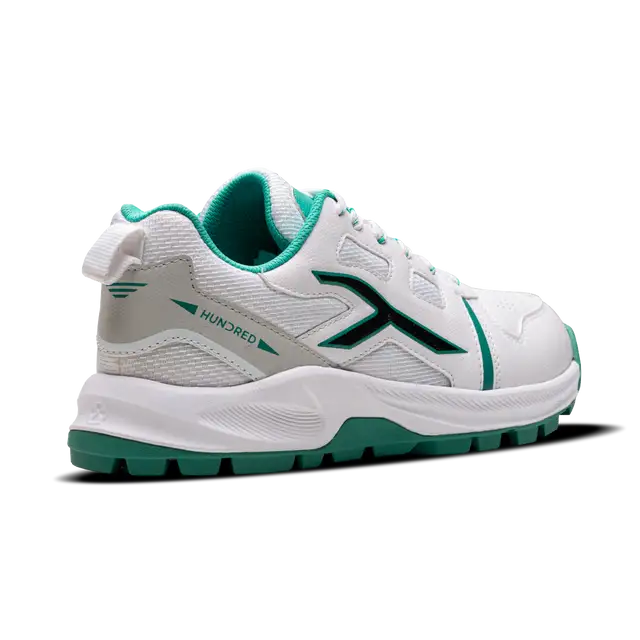 Close-up of Hundred Hyperturf cricket shoes featuring durable sole grip and sleek athletic design.
