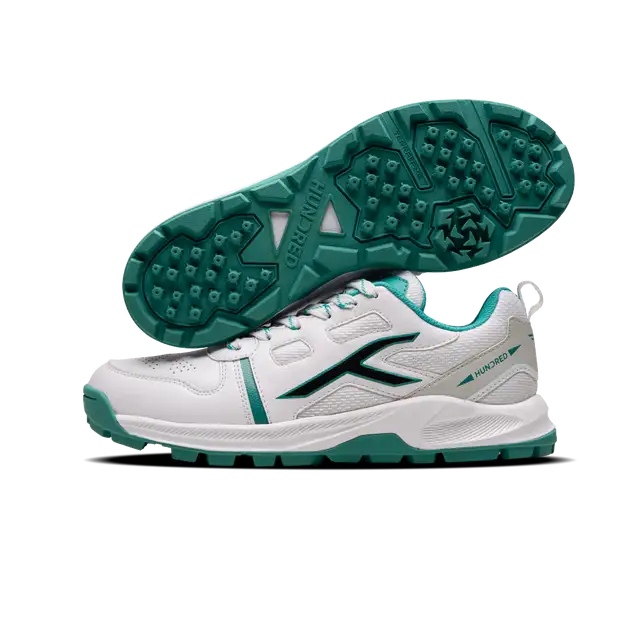 Close-up of Hundred Hyperturf cricket shoes featuring durable sole grip and sleek athletic design.