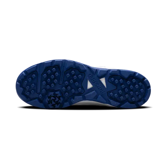 Close-up of Hundred Hyperturf cricket shoes featuring durable sole grip and sleek athletic design.