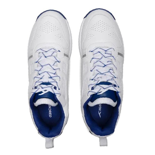 Close-up of Hundred Hyperturf cricket shoes featuring durable sole grip and sleek athletic design.