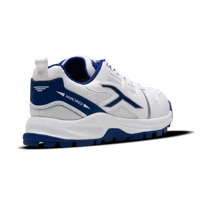 Close-up of Hundred Hyperturf cricket shoes featuring durable sole grip and sleek athletic design.