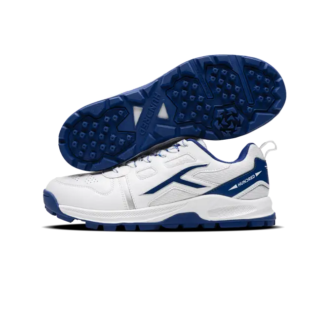 Close-up of Hundred Hyperturf cricket shoes featuring durable sole grip and sleek athletic design.