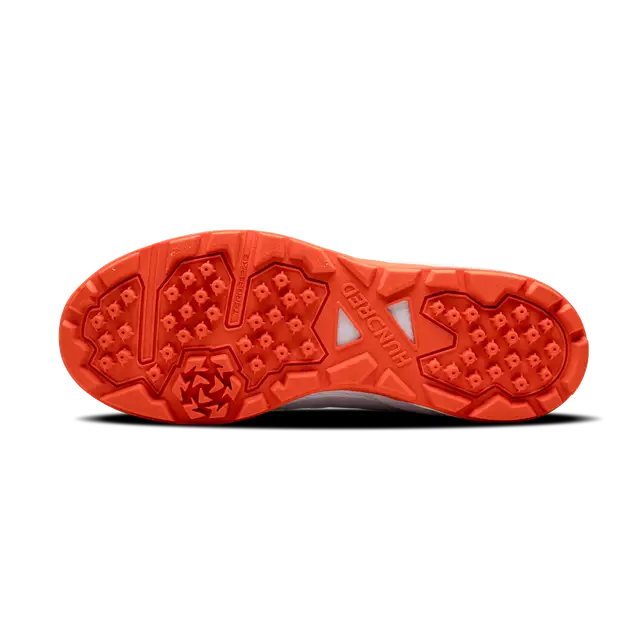 Close-up of Hundred Hyperturf cricket shoes featuring durable sole grip and sleek athletic design.