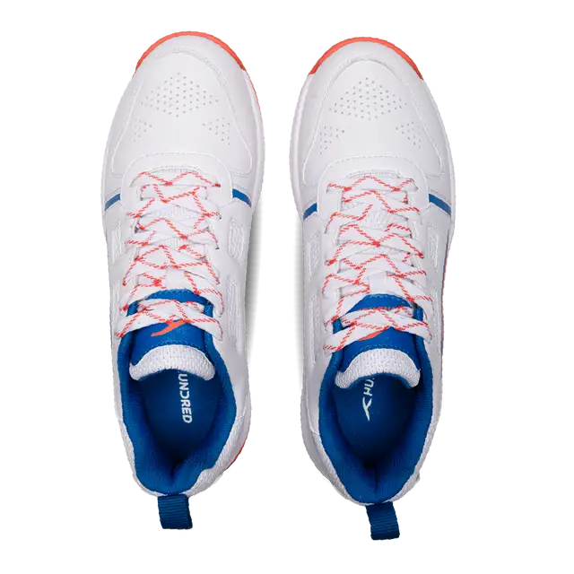Close-up of Hundred Hyperturf cricket shoes featuring durable sole grip and sleek athletic design.