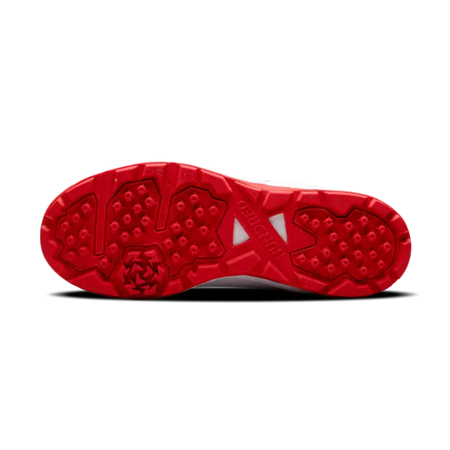 Close-up of Hundred Hyperturf cricket shoes featuring durable sole grip and sleek athletic design.