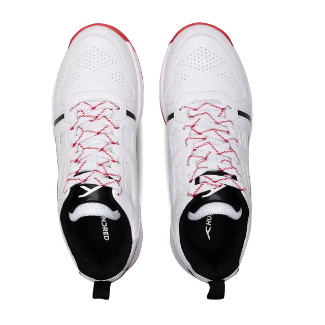 Close-up of Hundred Hyperturf cricket shoes featuring durable sole grip and sleek athletic design.