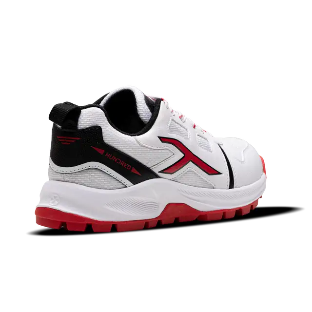 Close-up of Hundred Hyperturf cricket shoes featuring durable sole grip and sleek athletic design.