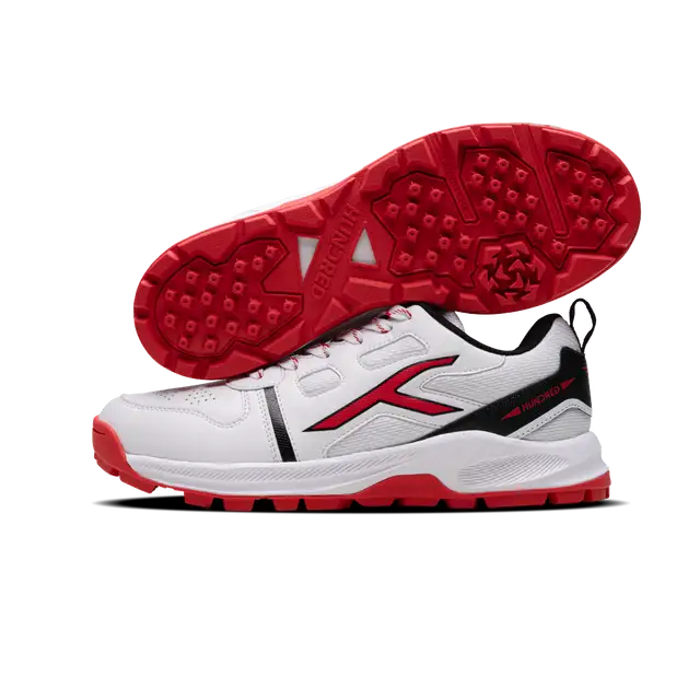 Close-up of Hundred Hyperturf cricket shoes featuring durable sole grip and sleek athletic design.