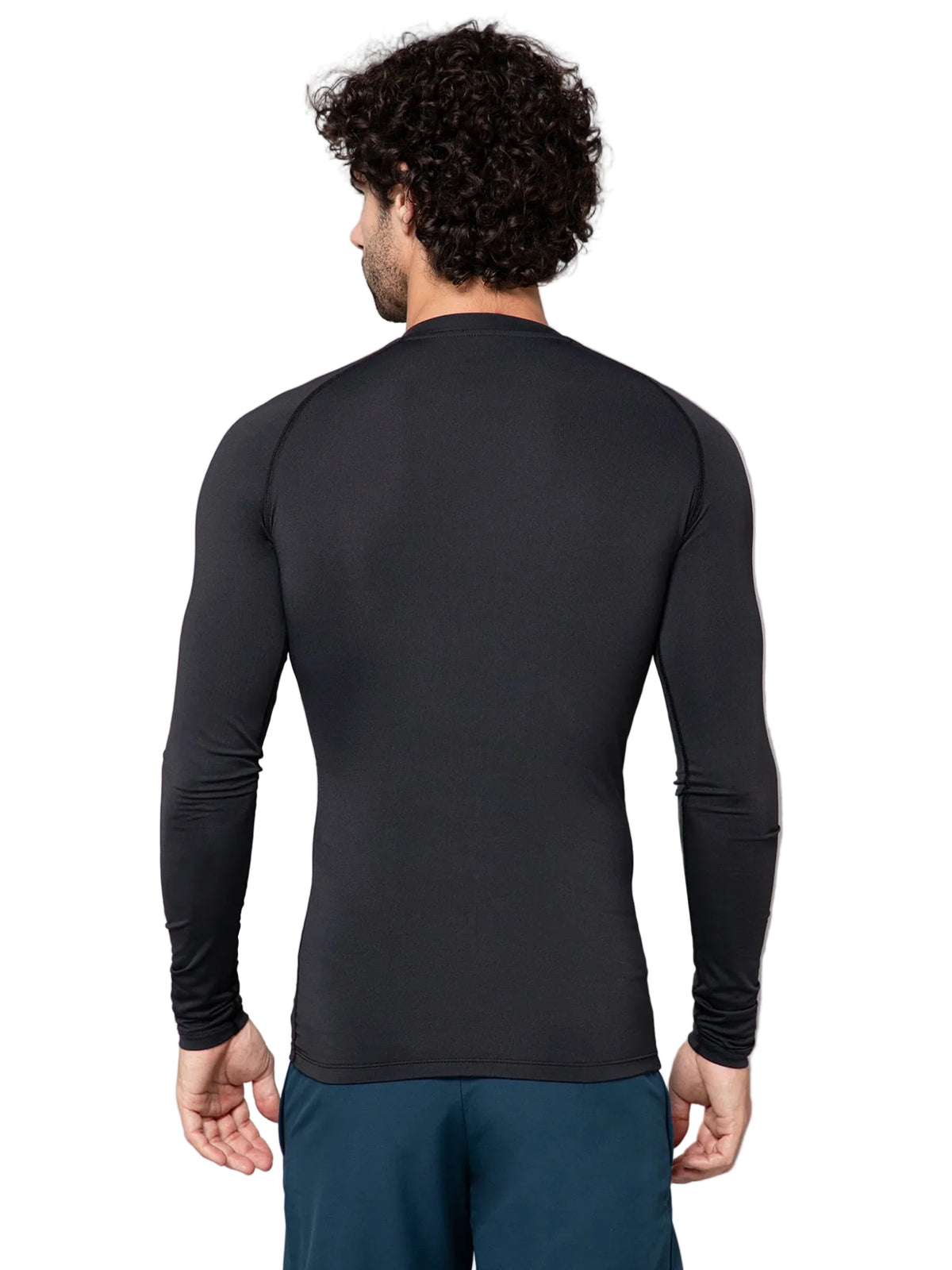 Man wearing a black long-sleeve athletic shirt on a gray background