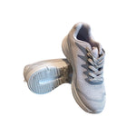 Gowin Racer running shoes on a track, highlighting their lightweight design and sporty look.