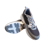 Gowin Running Shoes NX-4 placed on a fitness mat, featuring a cushioned sole and breathable mesh design.