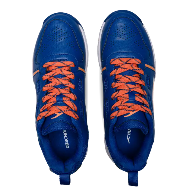 Close-up of Hundred Hyperturf cricket shoes featuring durable sole grip and sleek athletic design.
