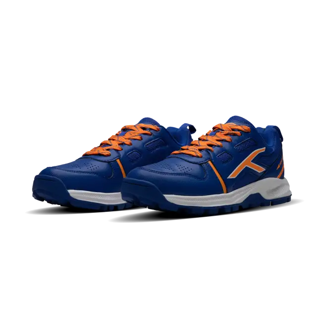 Close-up of Hundred Hyperturf cricket shoes featuring durable sole grip and sleek athletic design.
