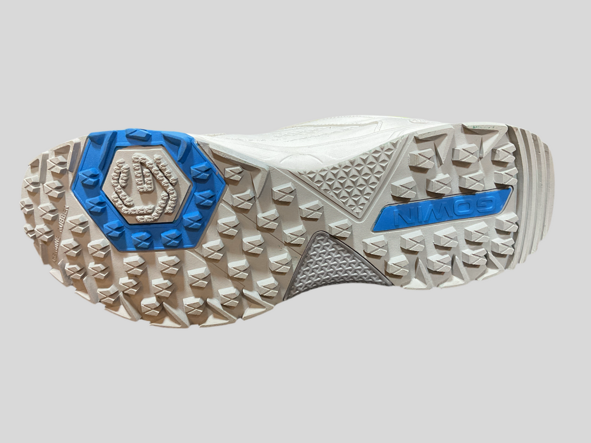 Gowin Cricket Shoes Turf Pro with studded sole and breathable upper design, displayed on artificial turf ground.