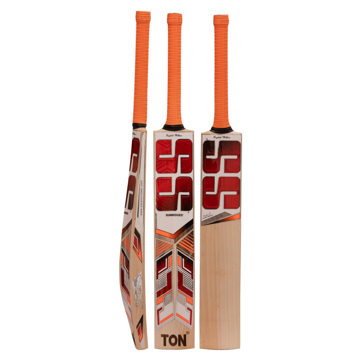 Close-up of an SS Tiger cricket bat resting on a lush green pitch, highlighting the bat’s sleek design and thick edges.