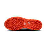 Close-up of Hundred Hyperturf cricket shoes featuring durable sole grip and sleek athletic design.