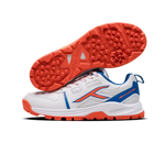 Close-up of Hundred Hyperturf cricket shoes featuring durable sole grip and sleek athletic design.